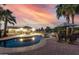 Scenic pool at dusk with vibrant sky reflections, offering a tranquil outdoor retreat with poolside seating at 3927 E Vista Grande --, San Tan Valley, AZ 85140