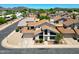Expansive aerial view of a suburban home with a two-car garage and mature trees in a friendly neighborhood at 4210 W Rosemonte Dr, Glendale, AZ 85308