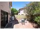 Cozy backyard area with a brick patio, barbecue grill, and table with chairs at 4210 W Rosemonte Dr, Glendale, AZ 85308