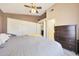 Bedroom featuring neutral colored walls, a ceiling fan, and a large closet with white doors at 4210 W Rosemonte Dr, Glendale, AZ 85308