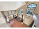 Bright living room with vaulted ceilings, a large picture window, and hardwood floors offering plenty of natural light at 4210 W Rosemonte Dr, Glendale, AZ 85308