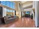 Spacious living room with abundant natural light, hardwood flooring, and a comfortable sofa perfect for relaxation at 4210 W Rosemonte Dr, Glendale, AZ 85308