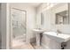Bright bathroom features double sink vanity and frameless glass shower with modern fixtures at 4225 N 21St St # 22, Phoenix, AZ 85016