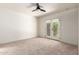Bedroom with a ceiling fan and French doors leading to a private outdoor space at 4225 N 21St St # 22, Phoenix, AZ 85016