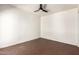 Bedroom with ceiling fan and brick floors with baseboards at 4225 N 21St St # 22, Phoenix, AZ 85016
