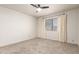 Neutral bedroom with a ceiling fan, carpet floors and a window with blinds and curtains at 4225 N 21St St # 22, Phoenix, AZ 85016