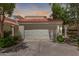 Inviting single-story home with a two-car garage, a red tile roof, and mature landscaping at 4225 N 21St St # 22, Phoenix, AZ 85016