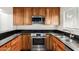 Stylish kitchen featuring granite countertops, stainless steel appliances, and custom cabinetry at 4225 N 21St St # 22, Phoenix, AZ 85016