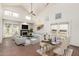 Bright living room featuring high ceilings, brick floors, a fireplace, and modern furnishings at 4225 N 21St St # 22, Phoenix, AZ 85016