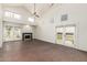 Bright living room with high ceilings, brick floors, fireplace, and outdoor access at 4225 N 21St St # 22, Phoenix, AZ 85016