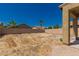 A spacious backyard with desert landscaping enclosed by block wall fencing at 45071 W Portabello Rd, Maricopa, AZ 85139