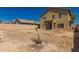View of home's backyard featuring ample space for landscaping and outdoor activities at 45071 W Portabello Rd, Maricopa, AZ 85139