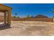 Expansive backyard with block wall fencing offering privacy and potential for landscaping at 45071 W Portabello Rd, Maricopa, AZ 85139