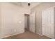 Bedroom with a closet and an open doorway leading to another room at 45071 W Portabello Rd, Maricopa, AZ 85139