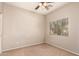 Bedroom with neutral walls, carpet flooring, and a window offering natural light at 45071 W Portabello Rd, Maricopa, AZ 85139
