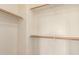 A closet featuring shelving with bars for ample storage space at 45071 W Portabello Rd, Maricopa, AZ 85139