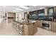 Large modern kitchen island with stainless steel appliances at 4835 E Onyx Ave, Paradise Valley, AZ 85253