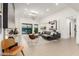 Open floor plan with modern decor, skylights, and view to the backyard at 4835 E Onyx Ave, Paradise Valley, AZ 85253