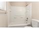 Bathroom features a bathtub-shower combo with white tiles and shelving at 520 N Stapley Dr # 257, Mesa, AZ 85203