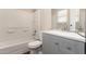 Bathroom features shower-tub combo with white tile surround, toilet, and vanity at 520 N Stapley Dr # 257, Mesa, AZ 85203