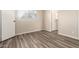 Bright bedroom with wood-look laminate flooring and windows for natural light at 520 N Stapley Dr # 257, Mesa, AZ 85203