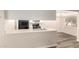 Kitchen with breakfast bar, stainless sink, laminate countertops and wood-style flooring at 520 N Stapley Dr # 257, Mesa, AZ 85203