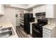 Functional kitchen features modern appliances, laminate countertops, and a convenient pantry for ample storage at 520 N Stapley Dr # 257, Mesa, AZ 85203