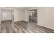 Spacious living room with sliding glass doors, neutral paint and modern wood-style flooring at 520 N Stapley Dr # 257, Mesa, AZ 85203