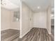 Living room features wood-style flooring, neutral paint, natural light, and sliding door at 520 N Stapley Dr # 257, Mesa, AZ 85203