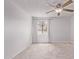 Bright bedroom featuring neutral carpet, a ceiling fan, and a window dressed with curtains at 533 W Guadalupe Rd # 2126, Mesa, AZ 85210