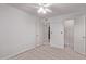 Bedroom with neutral carpet leading to bathroom and closet at 533 W Guadalupe Rd # 2126, Mesa, AZ 85210