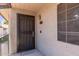Apartment entrance featuring a secure door, unit number 216, exterior light and window with blinds at 533 W Guadalupe Rd # 2126, Mesa, AZ 85210