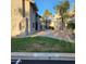 A well maintained grassy courtyard is seen between buildings in this condo community at 533 W Guadalupe Rd # 2126, Mesa, AZ 85210