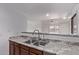 Kitchen sink with granite countertops and views of the living room area at 533 W Guadalupe Rd # 2126, Mesa, AZ 85210