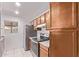 Kitchen with stainless steel appliances, wood cabinets, and plenty of natural light at 533 W Guadalupe Rd # 2126, Mesa, AZ 85210
