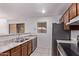 Functional kitchen with stainless steel appliances, granite countertops, and tiled backsplash at 533 W Guadalupe Rd # 2126, Mesa, AZ 85210