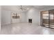 Well-lit living area features a fireplace, window, and sliding glass door for natural light at 533 W Guadalupe Rd # 2126, Mesa, AZ 85210