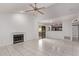 Spacious living room with a fireplace and tile flooring, open to the kitchen area at 533 W Guadalupe Rd # 2126, Mesa, AZ 85210
