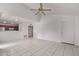 Bright, open-concept living area with tile floors and a ceiling fan, perfect for entertaining at 533 W Guadalupe Rd # 2126, Mesa, AZ 85210