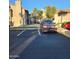 Exterior view showing ample parking in the condo complex with several vehicles at 533 W Guadalupe Rd # 2126, Mesa, AZ 85210