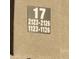 Close up of building address sign with the numbers 17, 2123-2126 and 1123-1126 at 533 W Guadalupe Rd # 2126, Mesa, AZ 85210