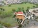 Aerial view of a community park featuring playgrounds, open green spaces, and scenic walking paths at 5871 N 187Th Ln, Litchfield Park, AZ 85340