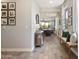 Warm and inviting home entryway with stylish decor, wood-look tile flooring, and a seamless transition to the living spaces at 5871 N 187Th Ln, Litchfield Park, AZ 85340