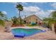 Backyard featuring a sparkling pool, covered patio, lush greenery, and comfortable seating at 5940 W Robinson Way, Chandler, AZ 85226
