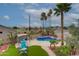 Beautiful backyard featuring a pool, tropical landscaping, a gazebo, and patio furniture at 5940 W Robinson Way, Chandler, AZ 85226