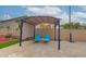 Patio showcasing lounge chairs beneath a shaded pergola with string lights at 5940 W Robinson Way, Chandler, AZ 85226