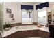Elegant bathroom featuring a garden tub with mosaic tile surround and a bright window at 5940 W Robinson Way, Chandler, AZ 85226