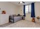 Cozy bedroom with daybed, ceiling fan, and neutral decor creating a relaxing space at 5940 W Robinson Way, Chandler, AZ 85226
