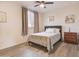 Cozy bedroom with a queen-sized bed, neutral decor, and hardwood floors offering a peaceful retreat at 5940 W Robinson Way, Chandler, AZ 85226