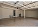 Spacious garage with epoxy flooring, ample storage space, and insulated garage door at 5940 W Robinson Way, Chandler, AZ 85226